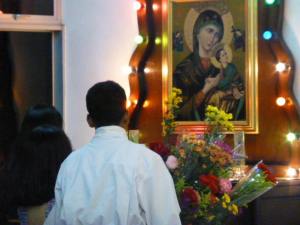 Flowers brought before the portrait of the Blessed Mother Mary. 