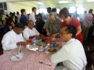 From left, seating: Fr Suresh, Fr Joseph and Fr Paul being served at the event. 
