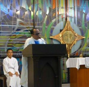 Fr Rhobby delivering his sermon: 'By praying the Rosary, we are reminded of how Mary was very much involved in the life of Jesus.' 